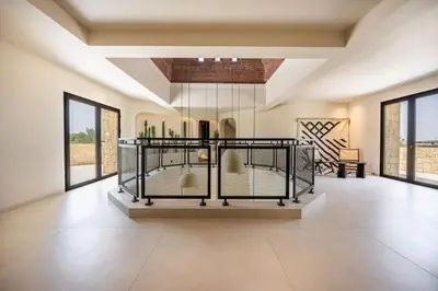 a room with a display case with bottles in it at MIKESTAY Domaine ATIKA in Segraga