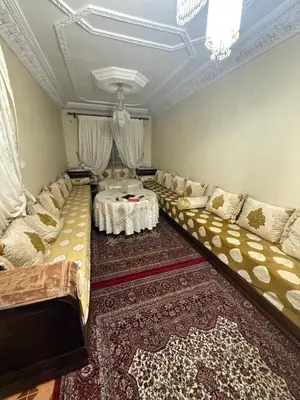 a large living room with couches and a table at Yassine in Marrakech