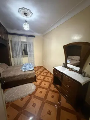 a bedroom with a bed and a sink and a mirror at Yassine in Marrakech