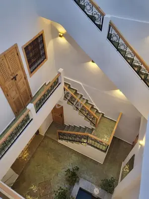 an overhead view of stairs in a house at Riad in Marrakech