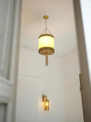 a chandelier hanging from a ceiling in a room at Riad privatif Les Tamaris in Marrakech