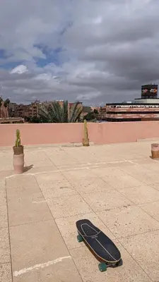 a skateboard laying on the ground on a sidewalk at Rooftop apartment with large terrace in Guéliz in Marrakech