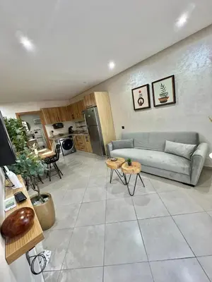 a living room with a couch and a table at New! Apartment F2 Gueliz Station Balcony renovated in Marrakech