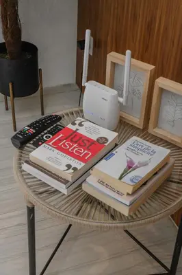 a group of books sitting on a table at Éminence Living in Marrakech