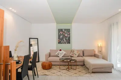 a living room with a couch and a table at Éminence Living in Marrakech