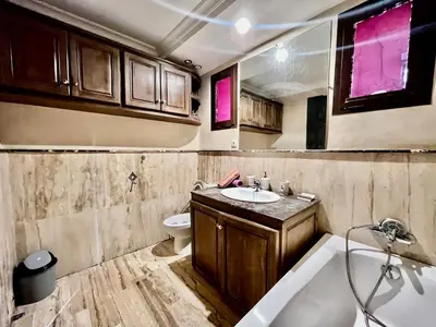 a bathroom with a tub and a sink and a toilet at City zen gueliz 1BR apartment in Marrakech