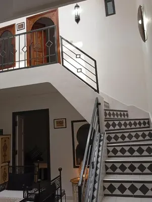 a staircase in a house with a stair case at Ryad Ayad in Marrakech