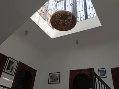 a staircase with a window and a ceiling at Ryad Ayad in Marrakech