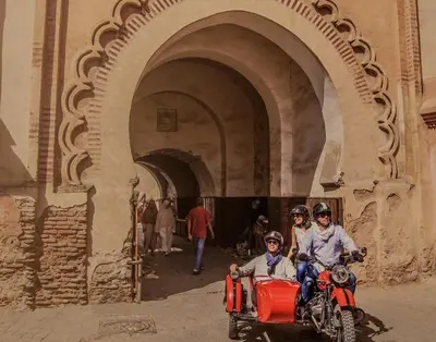 a group of people riding on a motor bike at Riad Adore in Marrakech