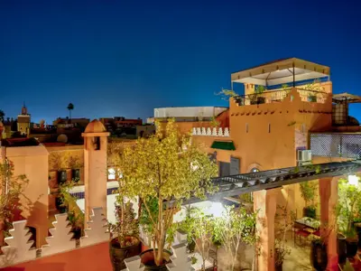 a view of a building with a bridge in front at Palais Tinmel Marrakech in Marrakech