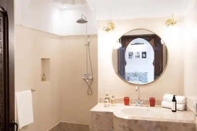 a bathroom with a sink and a mirror at Riad Sashema in Marrakech