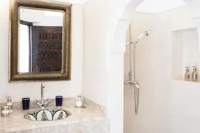 a bathroom with a sink and a mirror at Riad Sashema in Marrakech
