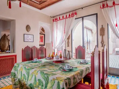 a room with a table with a table cloth on it at Riad Passali in Marrakech