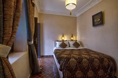 a hotel room with a bed in a room at Riad Bijoux Marrakech in Marrakech