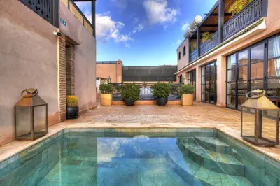 an indoor pool in the courtyard of a building at Riad Bijoux Marrakech in Marrakech