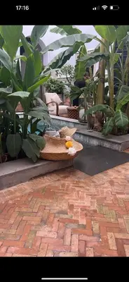 a basket with an orange on it sitting on a patio at Riad Azzar in Marrakech