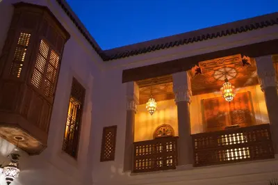 a building with a blue ceiling and chandeliers at Riad Siwan in Marrakech