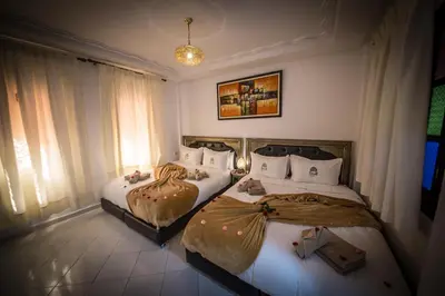 two beds in a hotel room with at Riad Challa Hotel & Spa in Marrakech