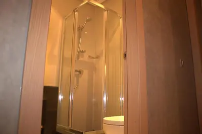 a bathroom with a shower and a toilet at Prestigia Golf City Apartment in Marrakech