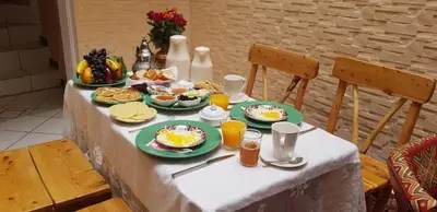 a table with plates of breakfast food on it at Riad Abjaou in Marrakech