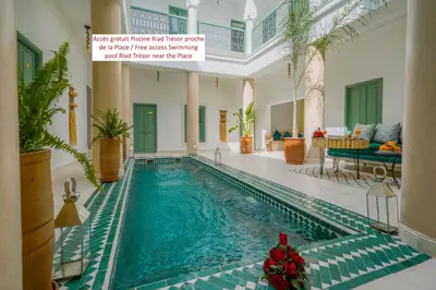 a swimming pool in a house with christmas decorations at Riad Sarah Sabrina in Marrakech