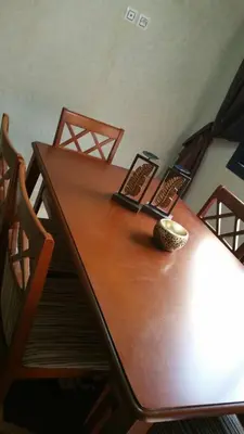 a wooden table with a bowl on top of it at Mouzdalifa Apartment In City Center in Marrakech