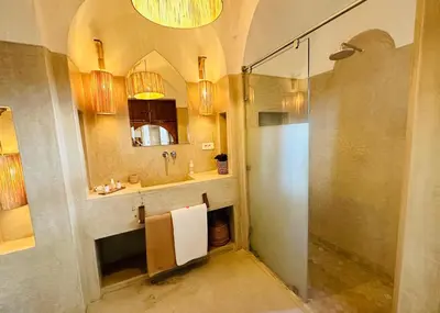 a bathroom with a shower and a sink at Riad Jardin Des Sens & Spa in Marrakech