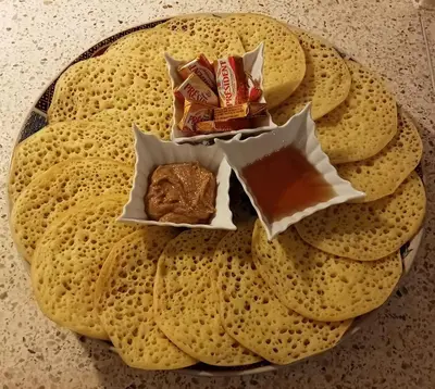 a plate of food with snacks on a table at Dar al Sultan in Marrakech