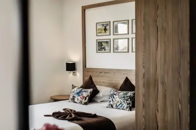 a bedroom with a bed with pillows on it at Wazo Appart-Hôtel in Marrakech