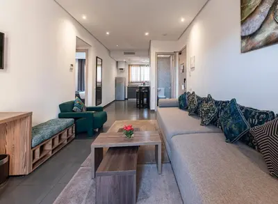 a living room with a couch and a table at Wazo Appart-Hôtel in Marrakech