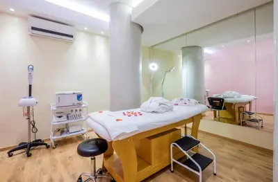 a hospital room with a bed and a mirror at Hotel Ayoub & Spa in Marrakech