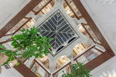 an overhead view of a building with a large window at Astra Damus Hotel in Marrakech