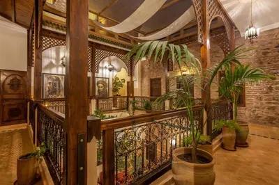 a balcony with a wrought iron fence and plants at Riad Dar Yema in Marrakech