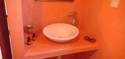 a bathroom with a white sink on a counter at Riad Safia in Marrakech