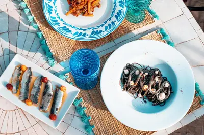 a table topped with plates of food on a table at Color Safrà in Marrakech