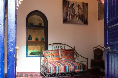 a room with a couch in a room with at Riad Tiziri in Marrakech