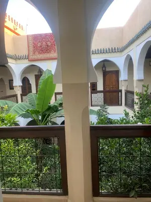 a view of the courtyard from inside the building at Riad Tidar by Phoenix in Marrakech