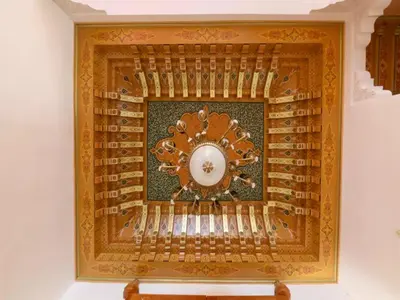 an ornate clock on a wall in a room at Maison d'hote Oceania in Marrakech