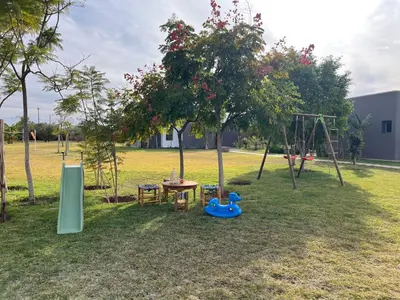 a park with a playground with a table and a swing at Villa Jardins D'Isa in Marrakech