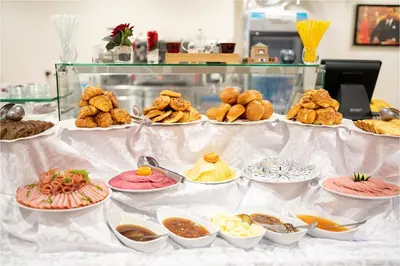 a buffet with plates of food on a table at Palm Menara Hotel Marrakech in Marrakech