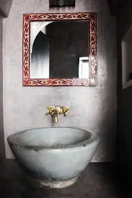 a sink in a bathroom with a mirror at Riad Al Tainam in Marrakech