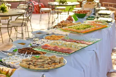 a table with many different types of food on it at Les Jardins De Zyriab in Aït Hamid