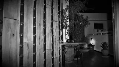 a wooden wall in a room with a table at Riad Safina in Marrakech