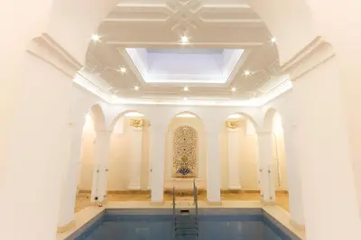 a large room with a ceiling and a pool at Riad Palais Des Princesses & Spa in Marrakech