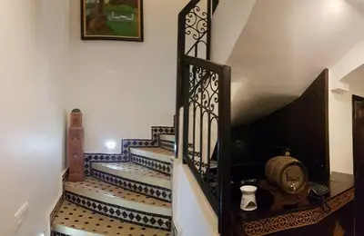 a stairway with blue and white tiles and a staircase at Les Rêves De Marrakech in Marrakech
