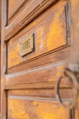 a wooden door with a sign that says true at Riad Le Jardin de Lea, Suites & Spa in Marrakech