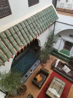 an overhead view of a house with a swimming pool at Riad Assalam in Marrakech