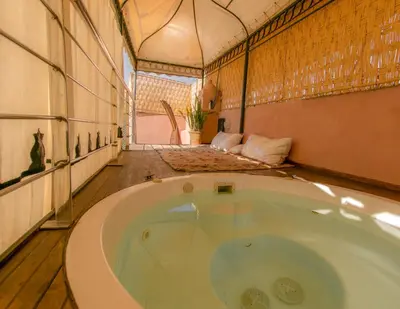 a large jacuzzi tub in a room at Dar Sohane in Marrakech
