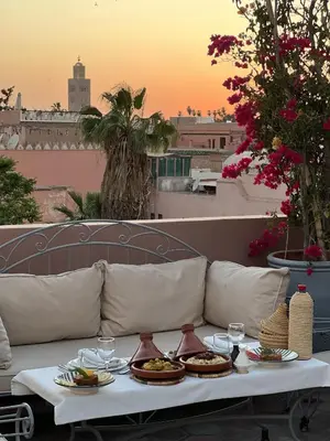 a table with plates of food on top of a couch at Monriad in Marrakech