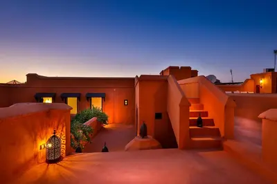 a view of a house in the desert at night at Hotel & Spa Dar Baraka & Karam in Marrakech